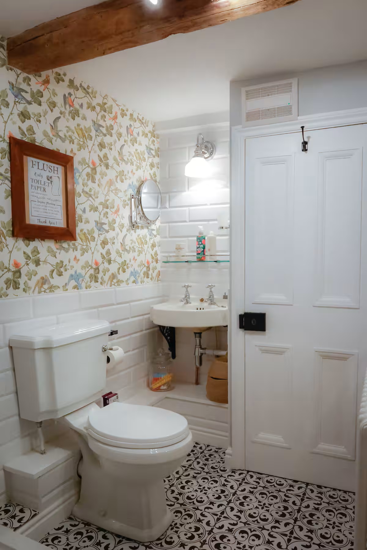 Bathroom with patterned floor and period details