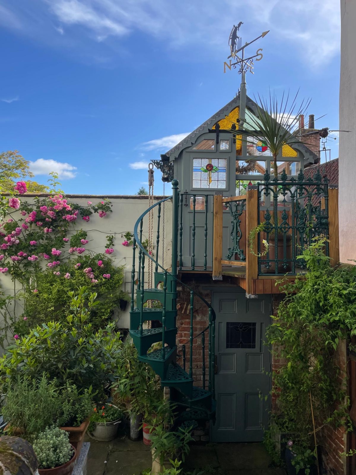 Spiral staircase and planting in the shared courtyard